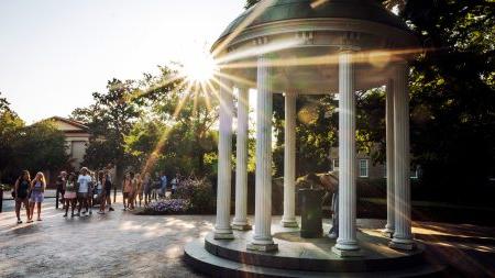 Students sip from Old Well